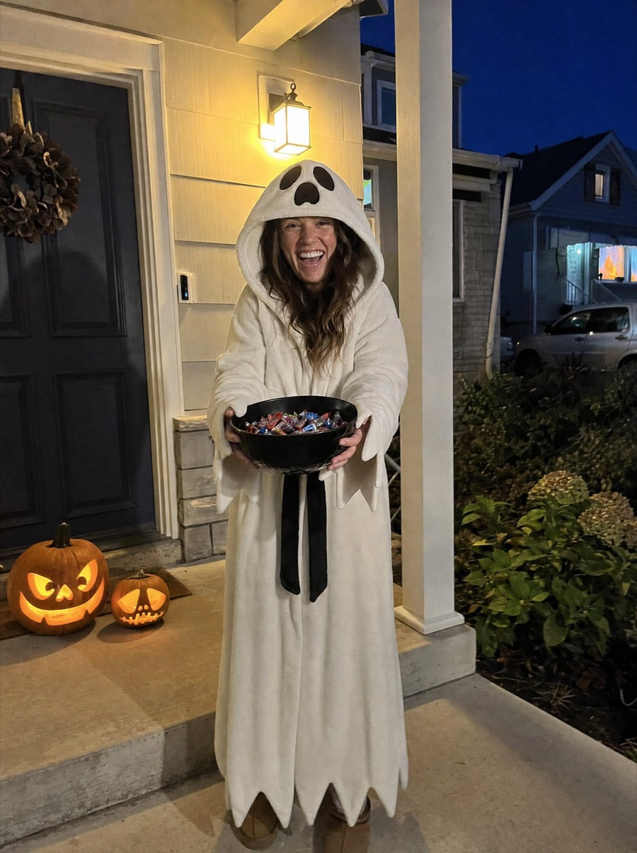 Handing out sweets on a cold porch